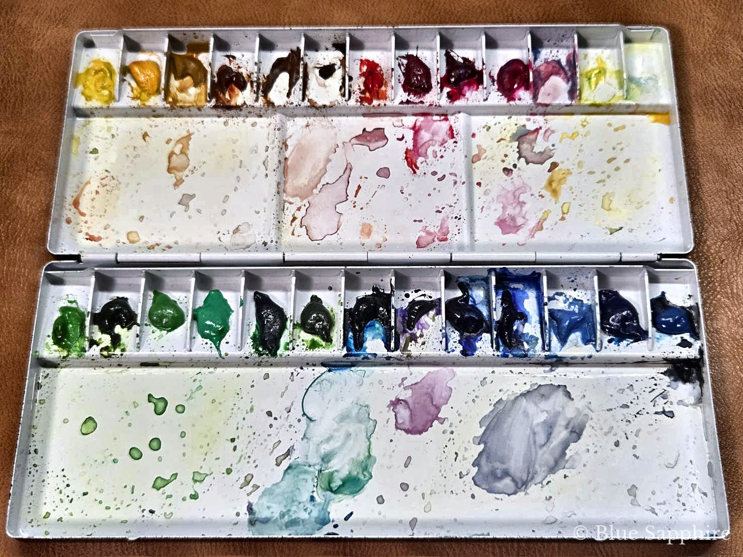 24 colours laid out in a Holbein aluminium palette No.80